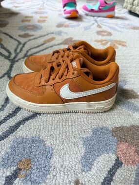 Nike Orange Low-Top Sneaker with White Swoosh